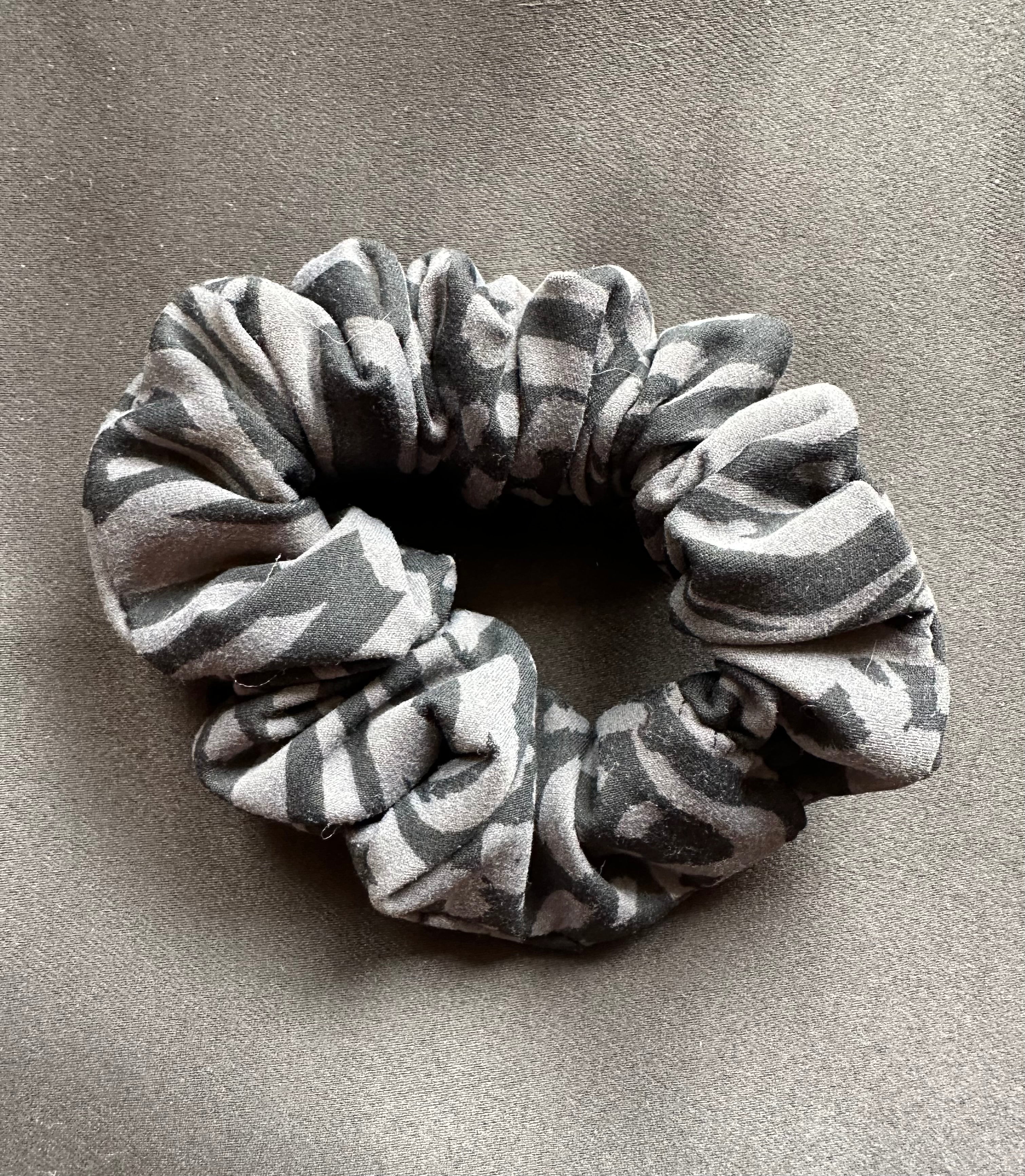 Striped scrunchie on a gray background